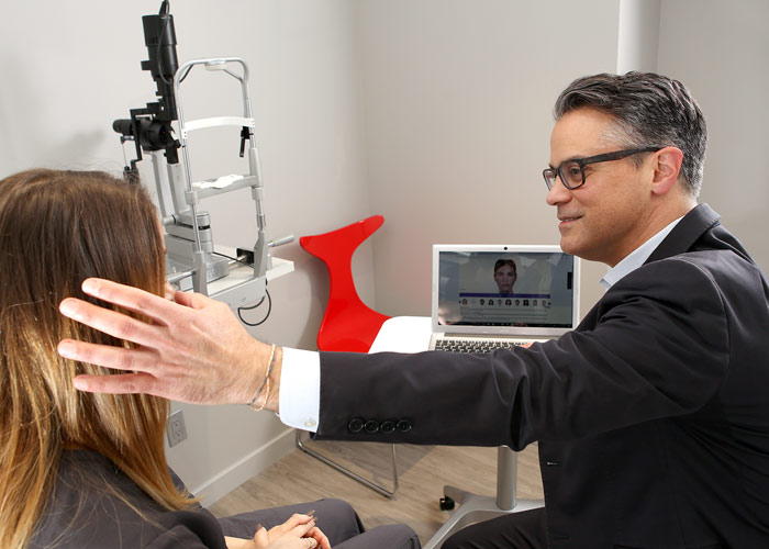 Dr. Sierra showing eyelid to patient